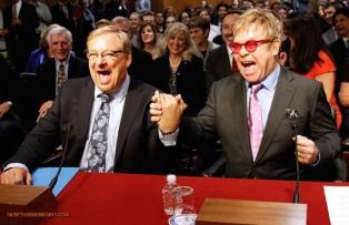 rick-warren-elton-john-holding-hands-joke-about-kissing-each-other.jpg